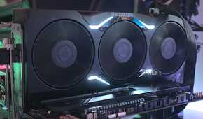 An image showing an AMD Radeon RX 7900 XTX GPU that's installed on a test bench.