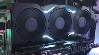 An image showing an AMD Radeon RX 7900 XTX GPU that's installed on a test bench.