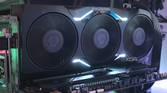 An image showing an AMD Radeon RX 7900 XTX GPU that's installed on a test bench.