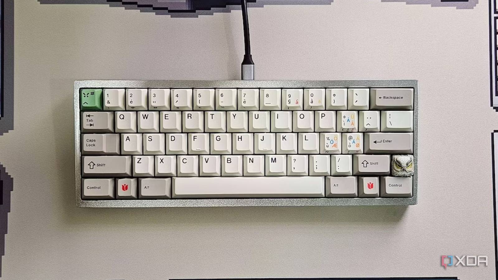 An image showing a mechanical keyboard kept on a deskmat.
