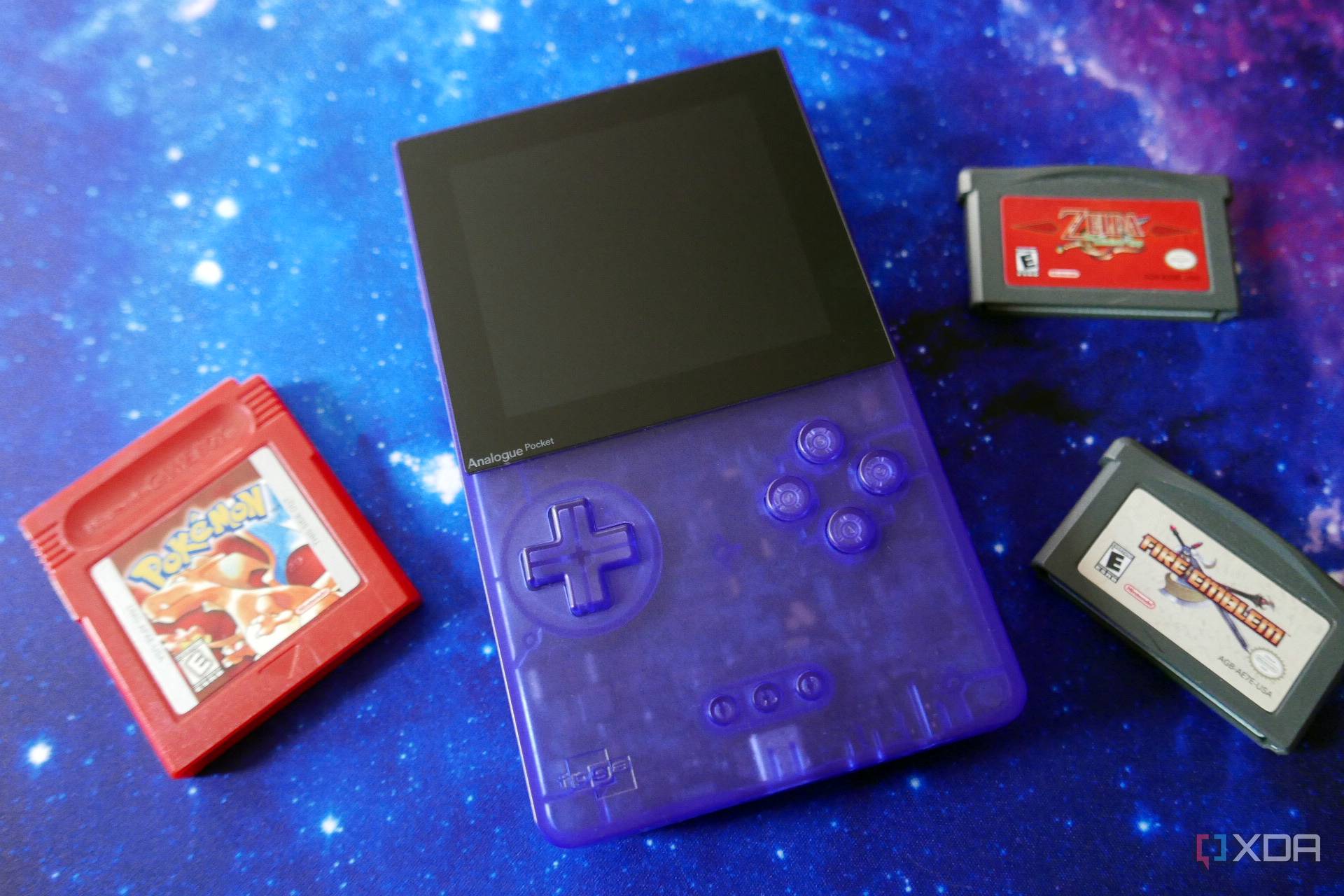 An Analogue Pocket surrounded by some older game cartridges