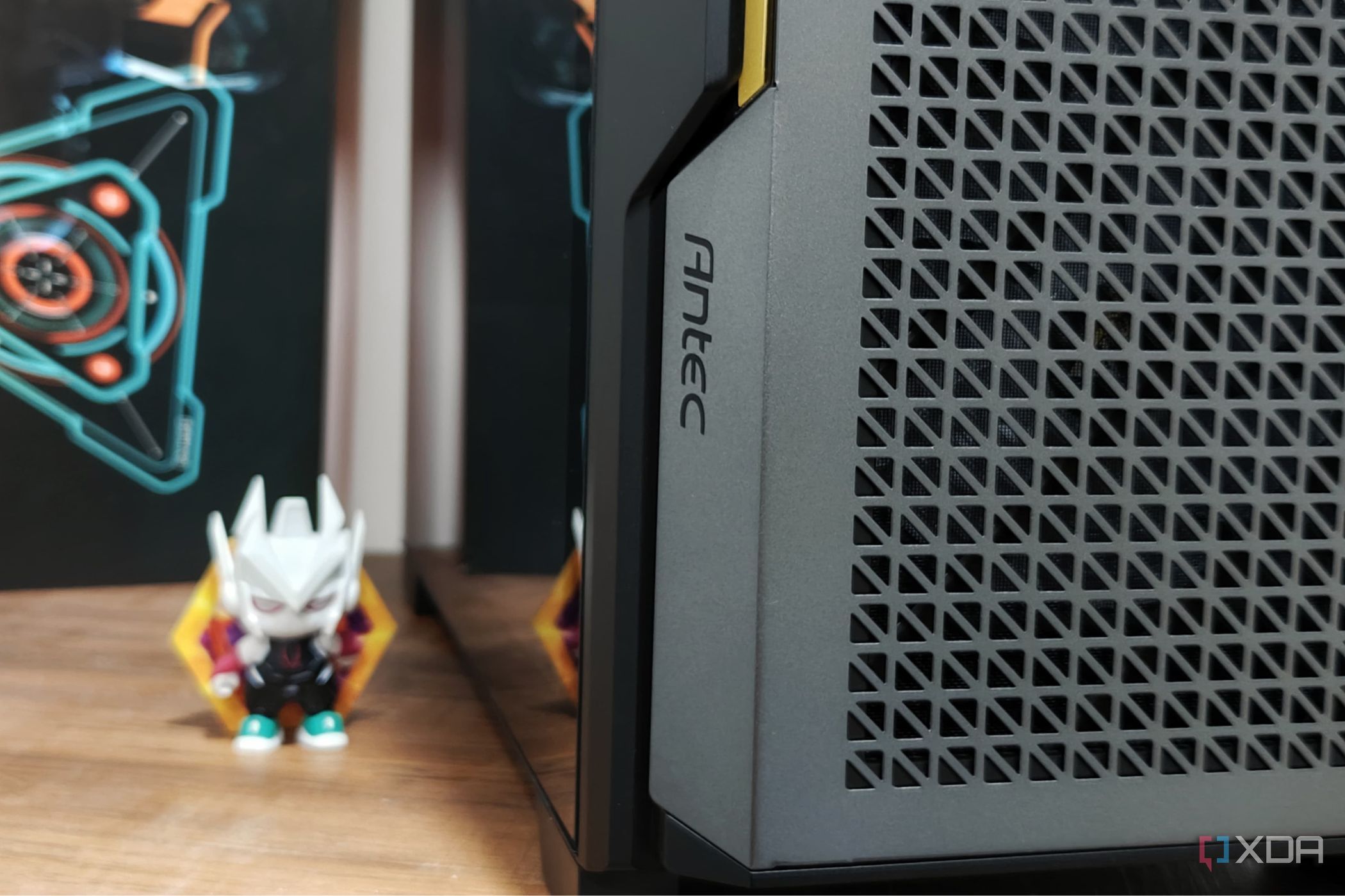 An image showing the Antec branding on the P20C case that's kept on a desk next to an action figure.