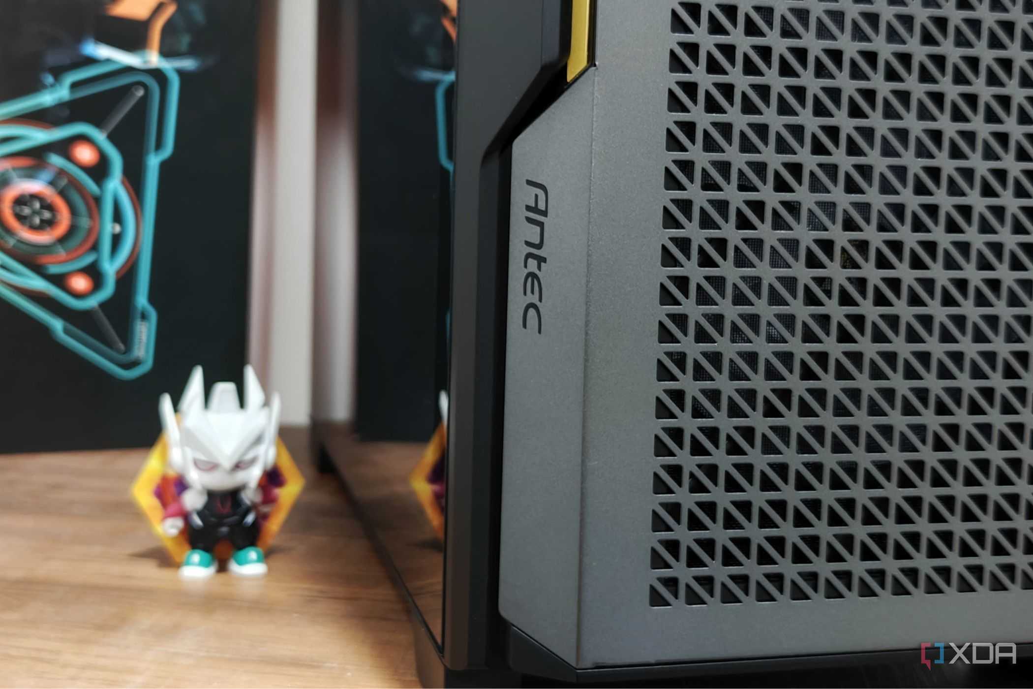 An image showing the Antec branding on the P20C case that's kept on a desk next to an action figure.
