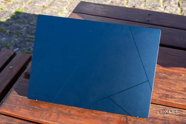 Rear view of the Asus Zenbook 14 OLED with the lid open at 60 degrees