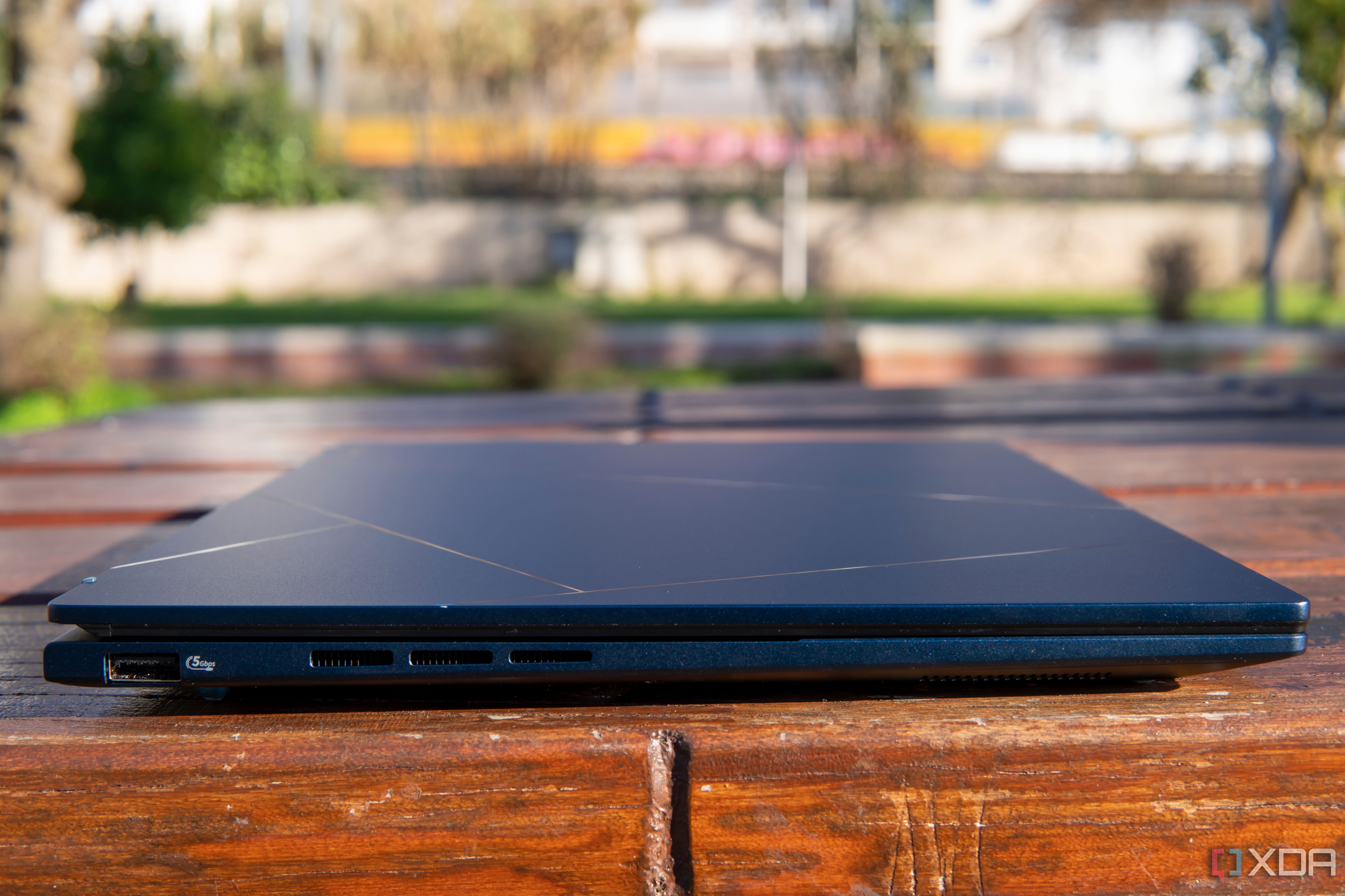 Left side view of the Asus Zenbook 14 OLED with the lid closed