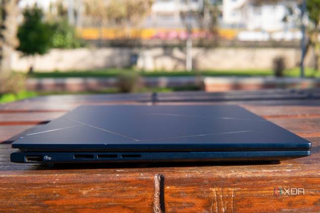 Left side view of the Asus Zenbook 14 OLED with the lid closed