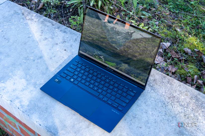 Angled front view of the Asus Zenbook 14 OLED with the lid open at about 100 degrees