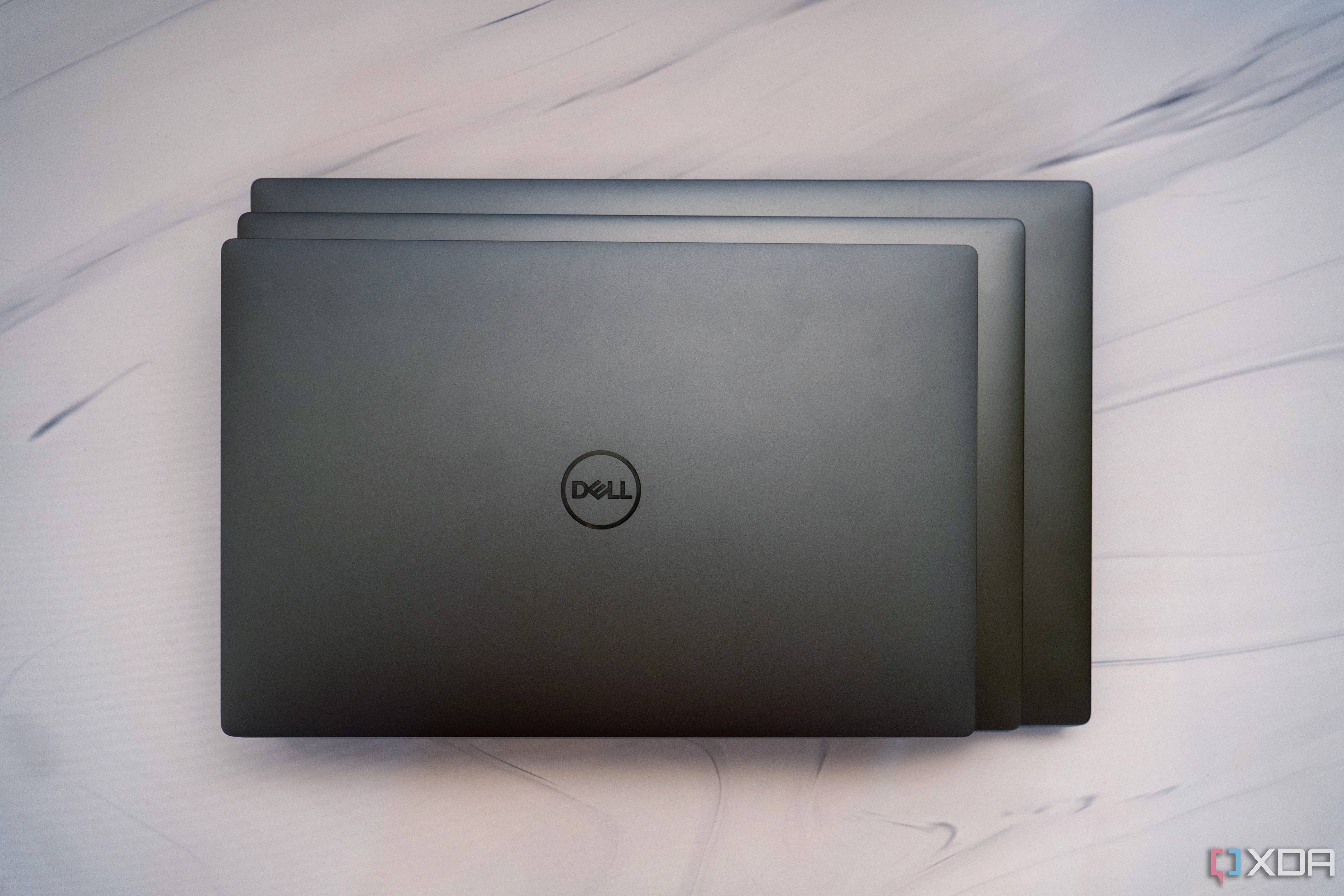 Overhead view of the The Dell XPS 13, 14, and 16 stacked on top of each other