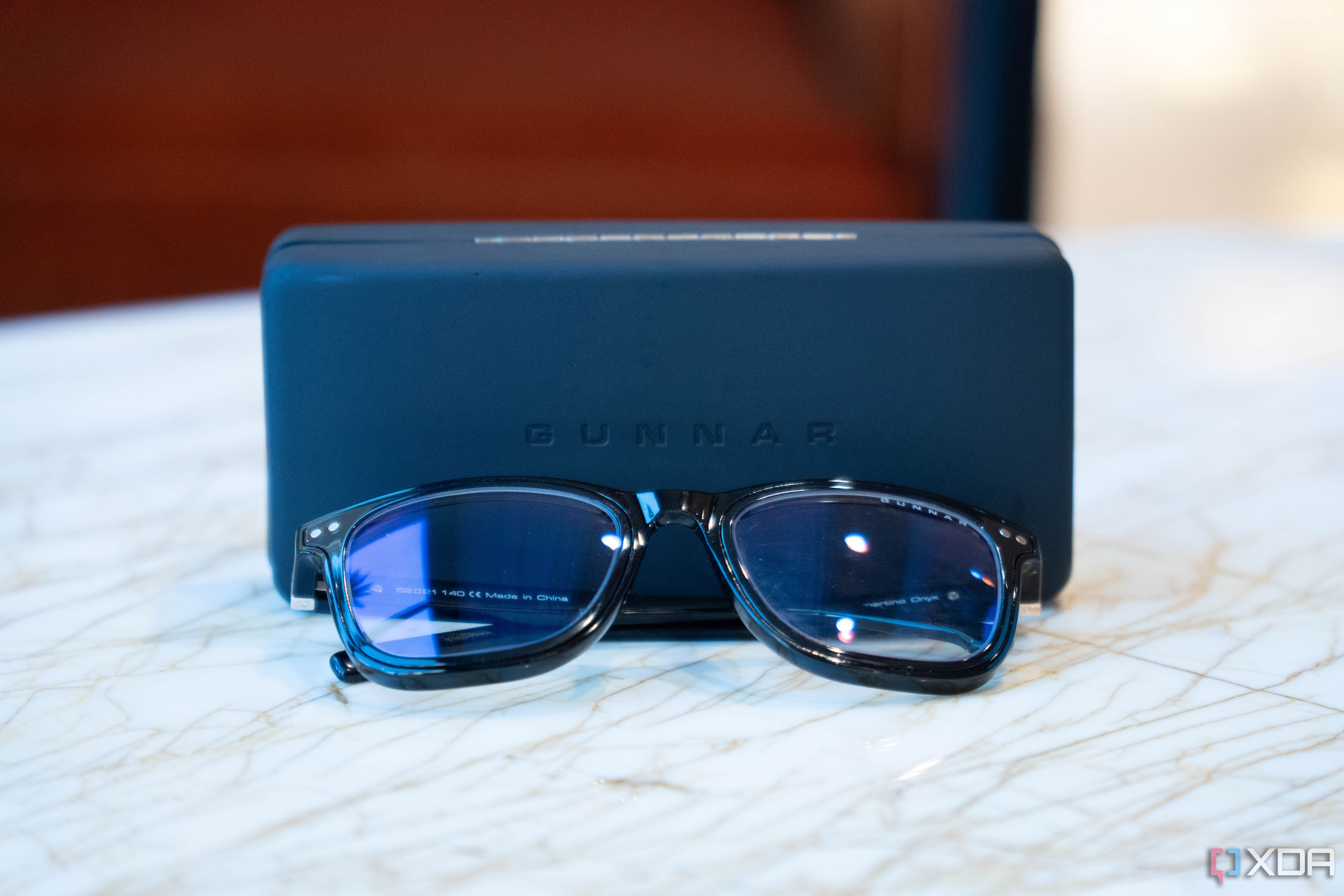 Giunnar Optiks Cupertino on marble table resting near case