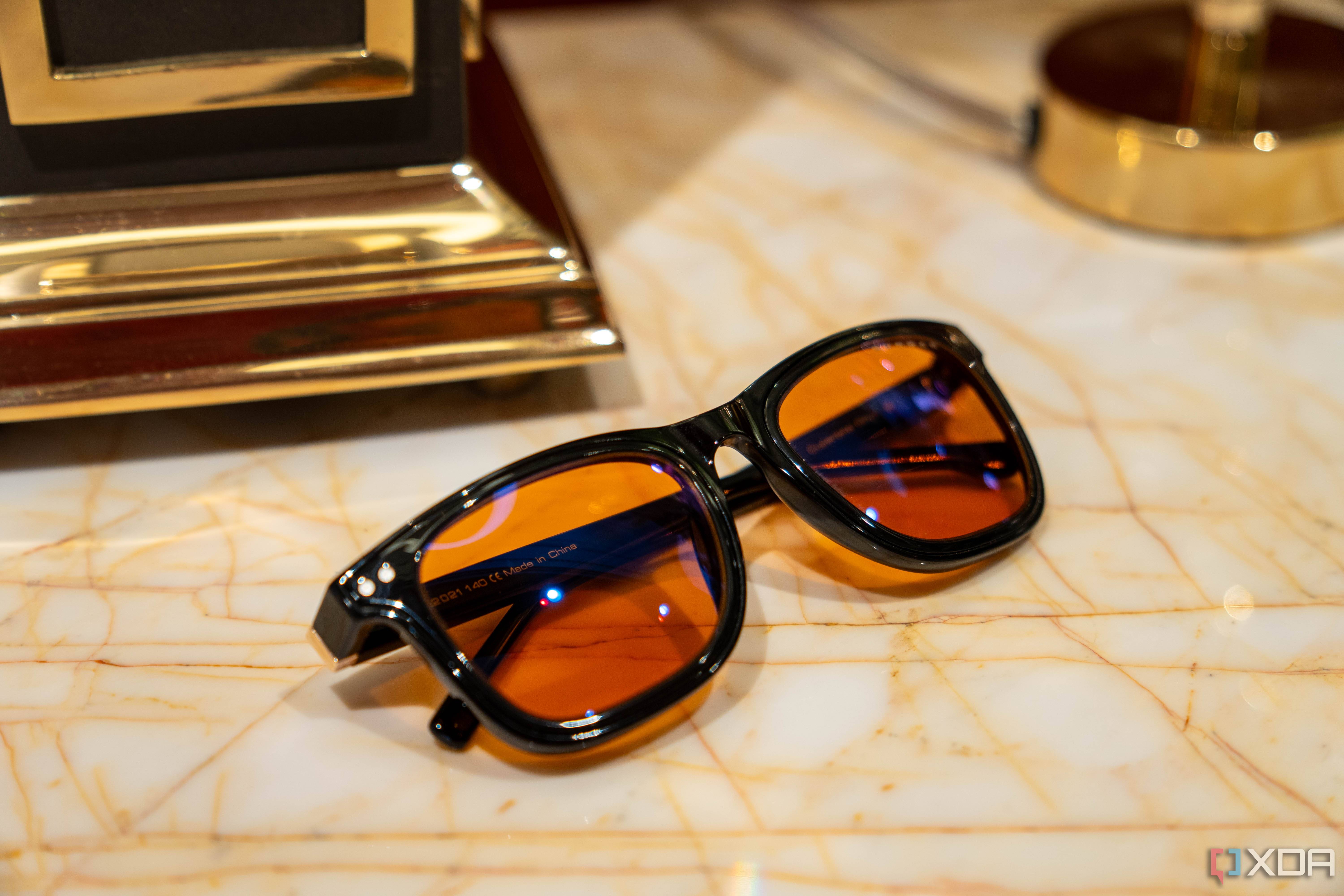 Giunnar Optiks Cupertino set on a marble table with Amber lenses