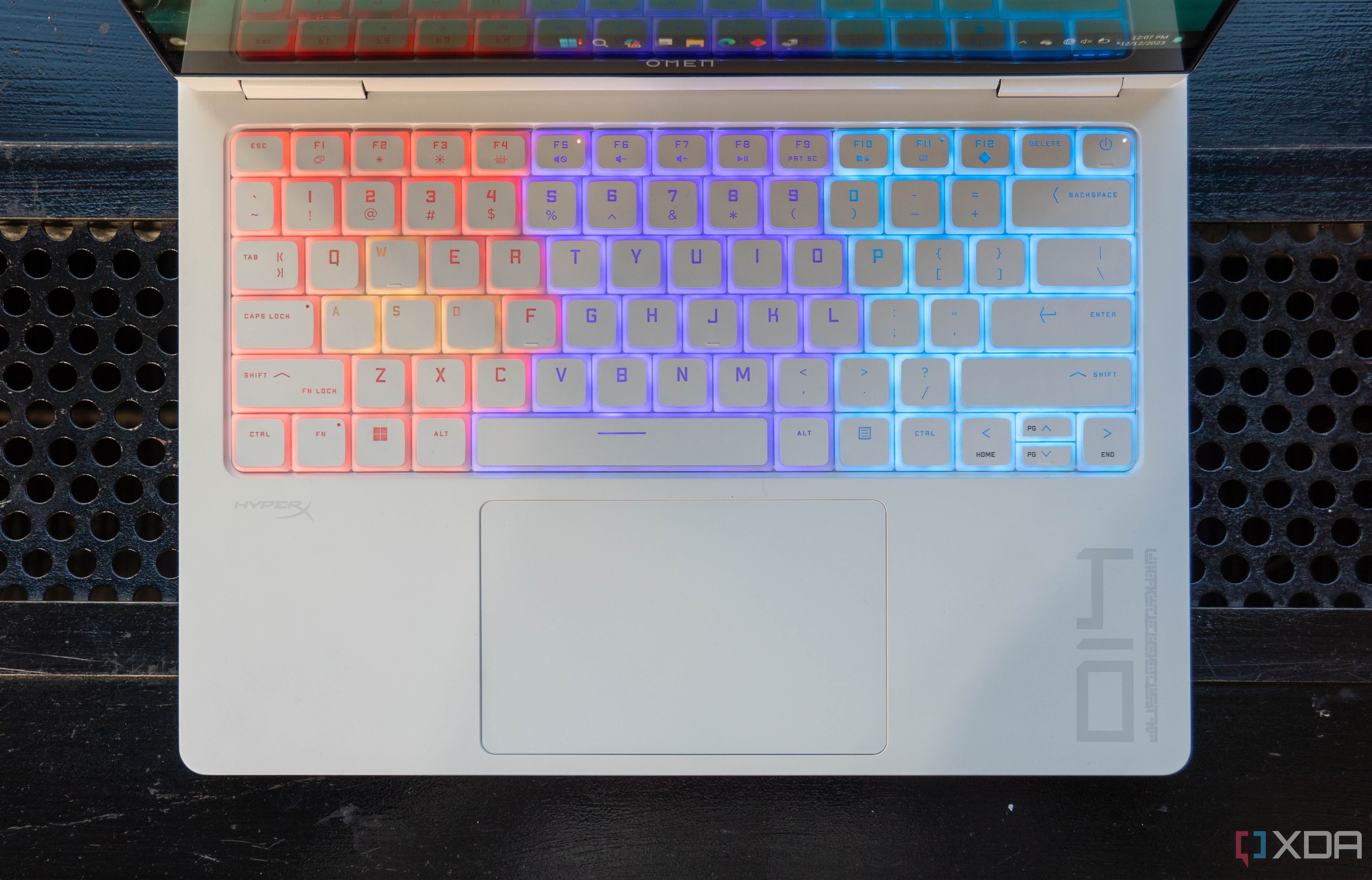 Overhead view of the keyboard on the Omen Transcend 14 with RGB lighting on