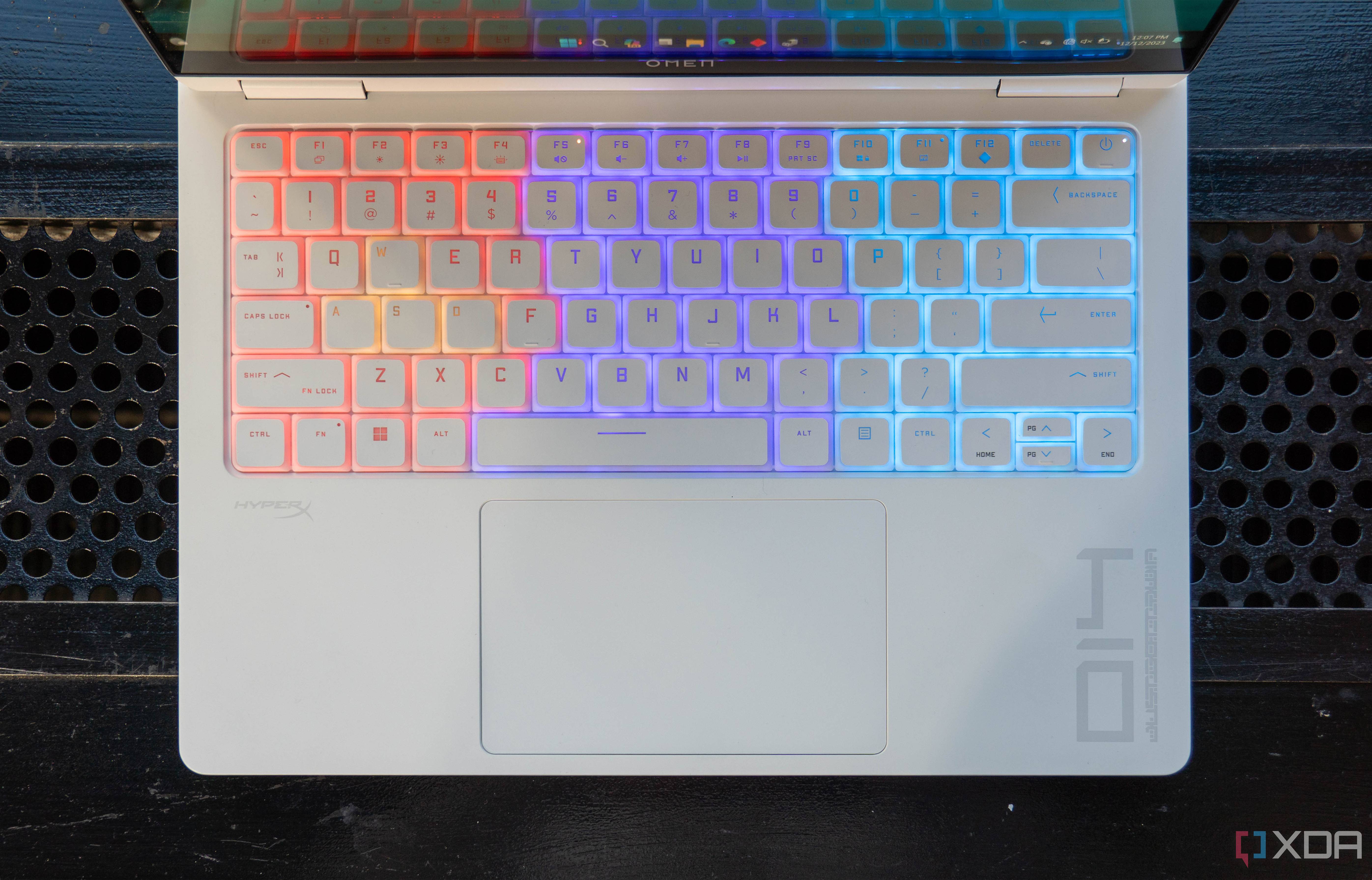 Overhead view of the keyboard on the Omen Transcend 14 with RGB lighting on