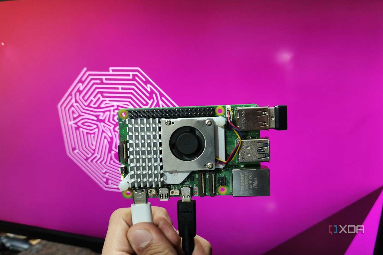 An image of a Raspberry Pi 5 kept in front of a monitor displaying the default Ubuntu GNOME desktop