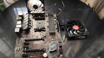 An image of a motherboard with two fans plugged in the fan headers.