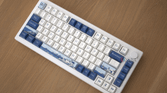 The Akko Santorini against a wooden background with the keyboard at a 45 degree angle