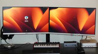 The front of a desk setup using the Insignia dual monitor mount.