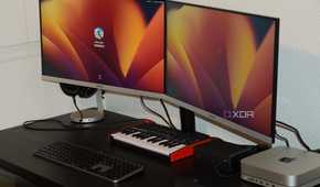 Two monitors propped up on the Insignia monitor mount.