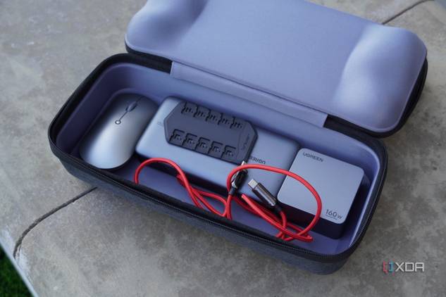Accessories inside the bottom compartment of the Jsaux Carrying Case.