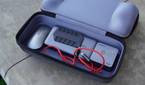 Accessories inside the bottom compartment of the Jsaux Carrying Case.