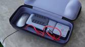 Accessories inside the bottom compartment of the Jsaux Carrying Case.