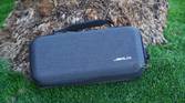 The Jsaux Carrying Case resting against a palm tree.