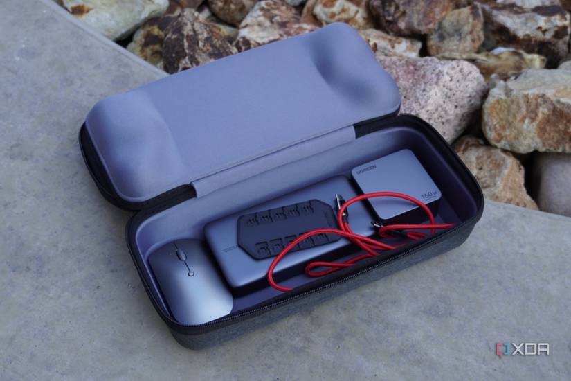Accessories in the bottom compartment of the ROG Ally case.