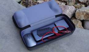 Accessories in the bottom compartment of the ROG Ally case.