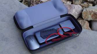Accessories in the bottom compartment of the ROG Ally case.