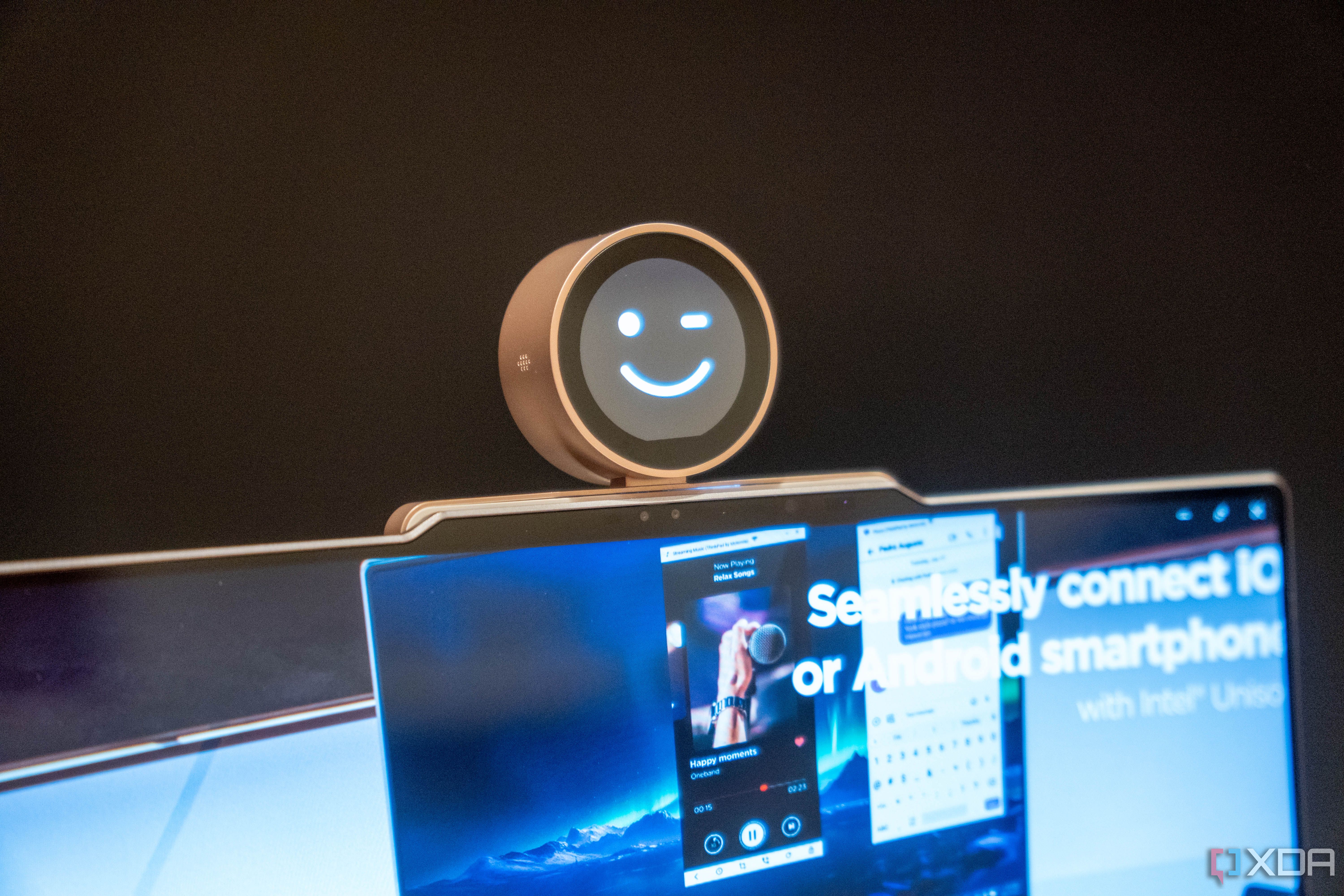 A Lenovo ThinkBook 13x Gen 4 with a concept Magic Bay accessory with a small screen that displays a smiley face