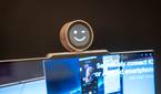 A Lenovo ThinkBook 13x Gen 4 with a concept Magic Bay accessory with a small screen that displays a smiley face