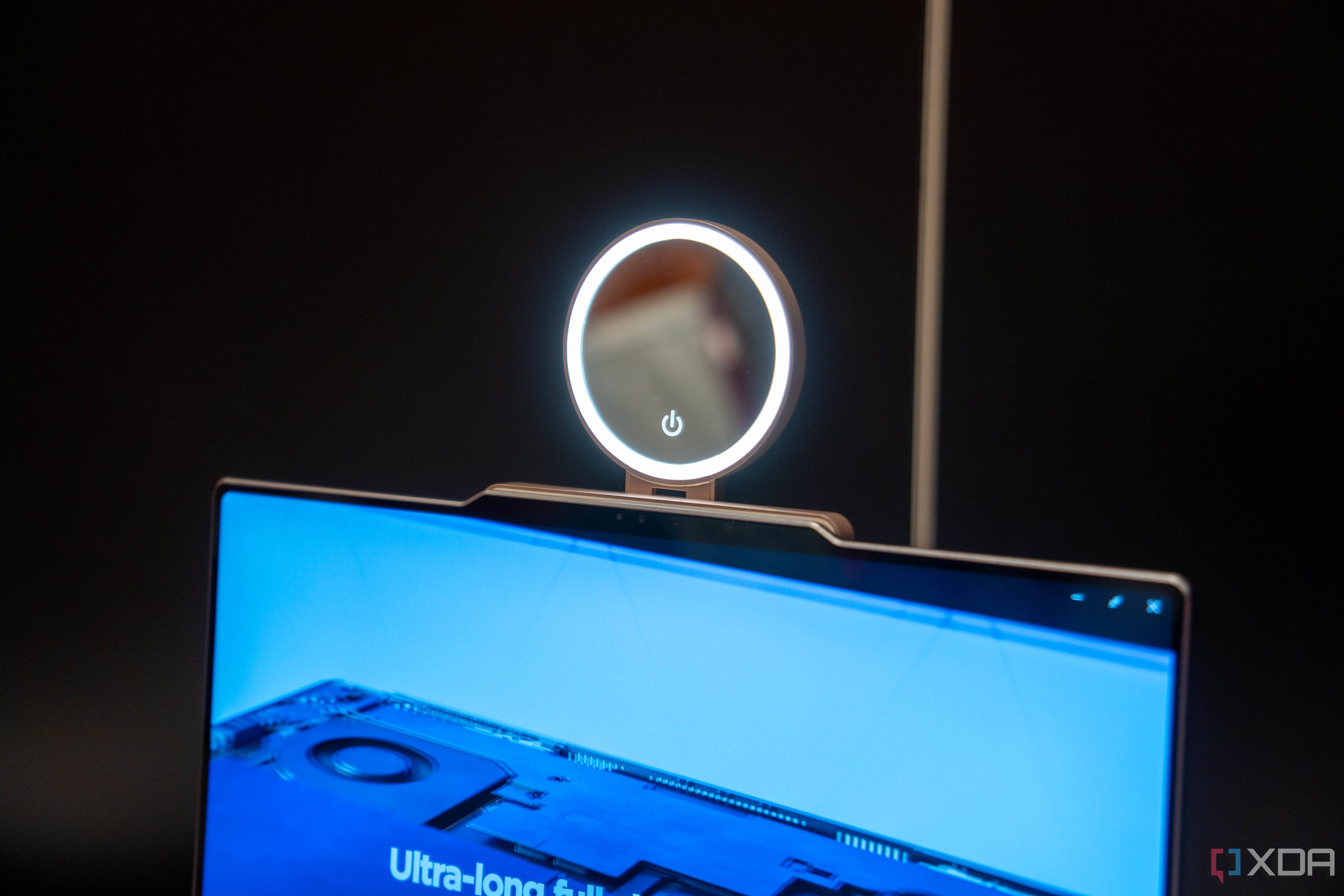 A Lenovo ThinkBook 13x Gen 4 with a concept Magic Bay accessory with a ring light