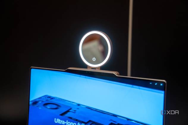 A Lenovo ThinkBook 13x Gen 4 with a concept Magic Bay accessory with a ring light