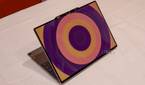 Angled view of the Lenovo ThinkBook 13x Gen 4 SPE showing a circular patter in orange and purple on the lid