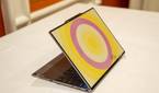 Angled view of the Lenovo ThinkBook 13x Gen 4 SPE showing a circular patter in yellow and pink on the lid