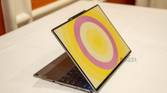 Angled view of the Lenovo ThinkBook 13x Gen 4 SPE showing a circular patter in yellow and pink on the lid