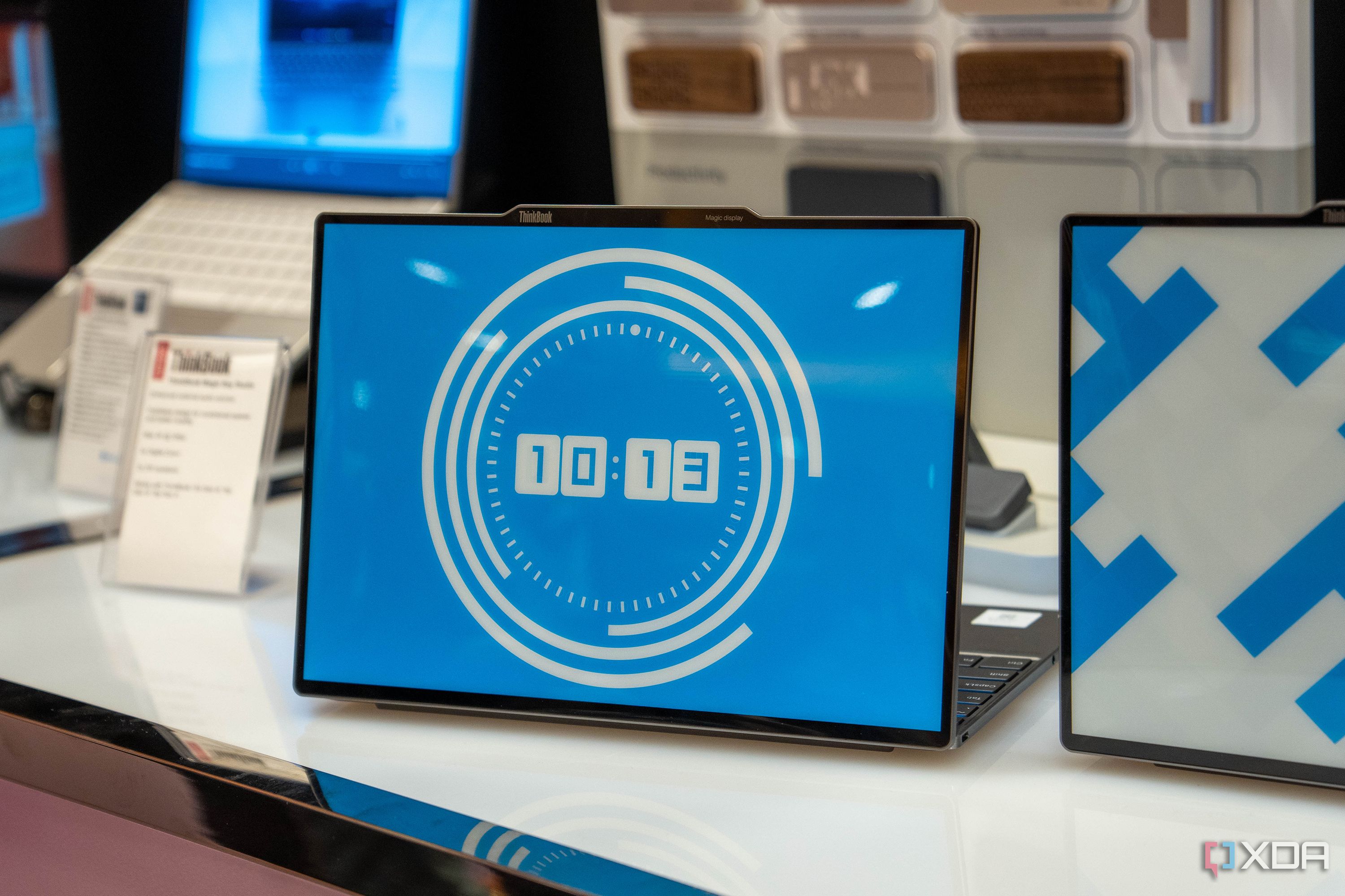 A Lenovo ThinkBook 13x Gen 4 SPE with a clock displayed on the E Ink display