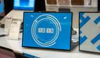 A Lenovo ThinkBook 13x Gen 4 SPE with a clock displayed on the E Ink display