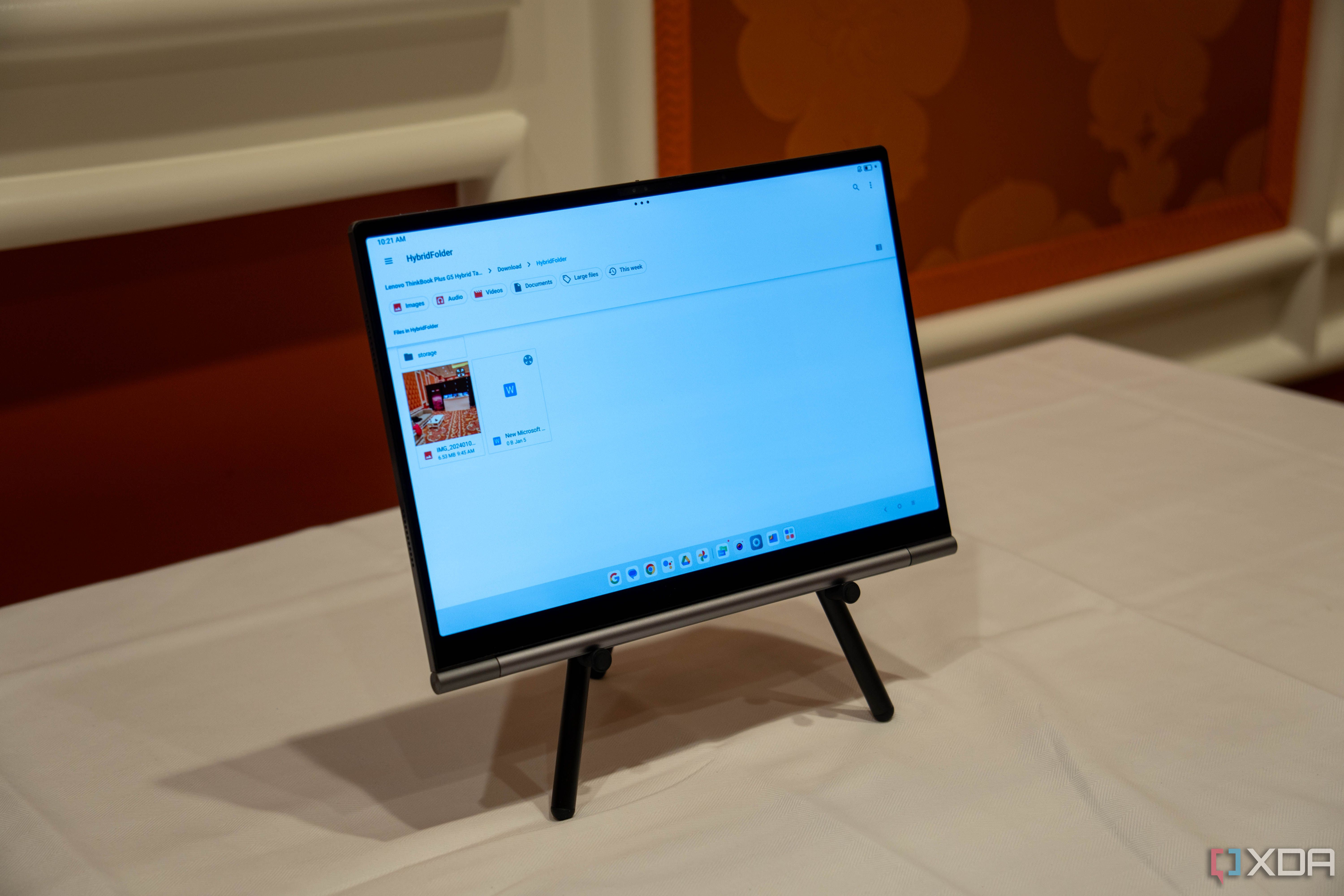 A Lenovo ThinkBook PLus Gen 5 Hybrid Tab on a stand