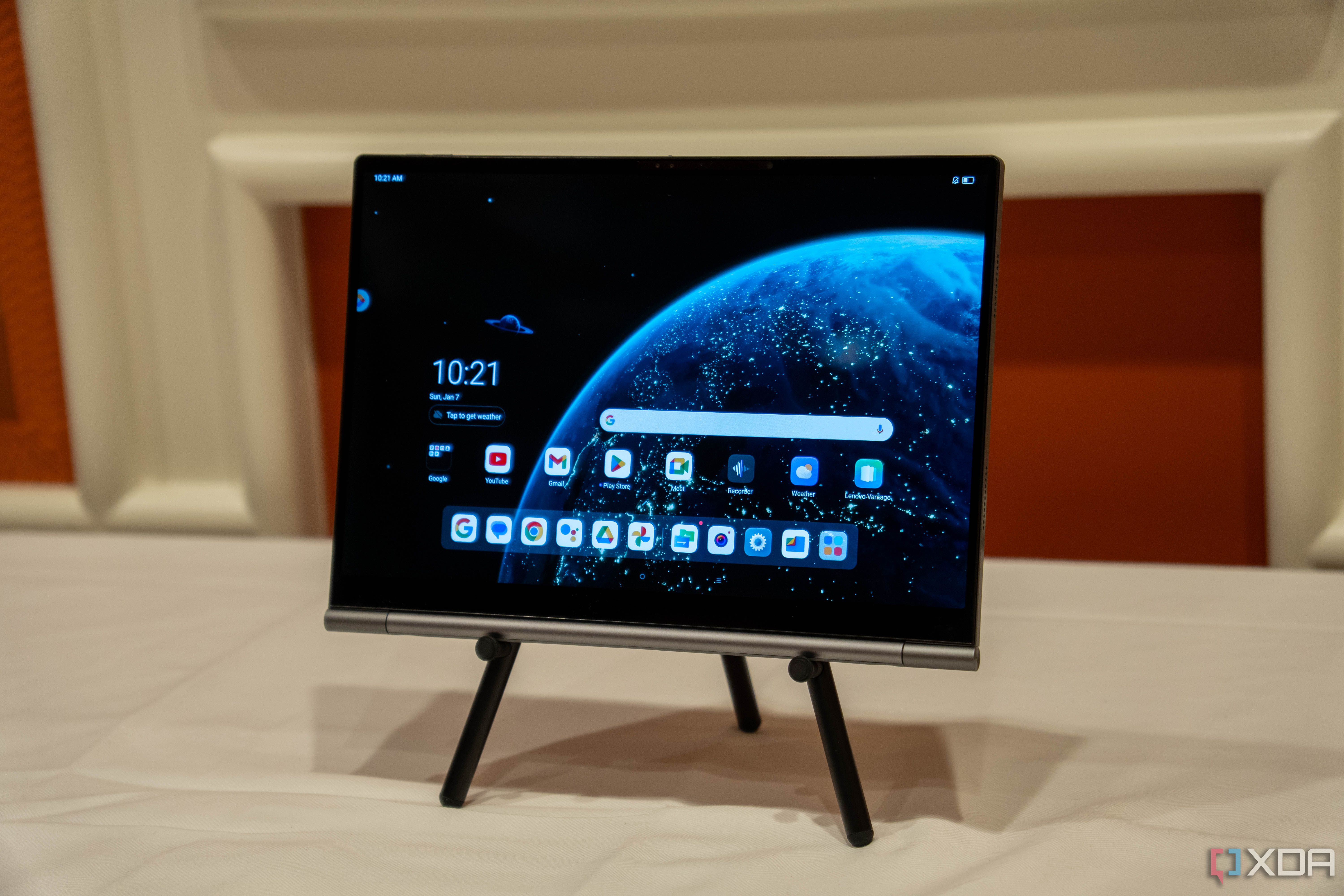 A Lenovo ThinkBook Plus Gen 5 Hybrid Tab on a stand showing the Android home screen