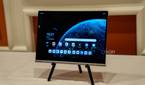 A Lenovo ThinkBook Plus Gen 5 Hybrid Tab on a stand showing the Android home screen