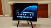 A Lenovo ThinkBook Plus Gen 5 Hybrid Tab on a stand showing the Android home screen