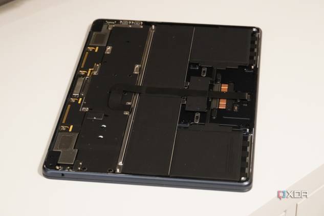 A wide shot of a MacBook with the bottom cover removed.