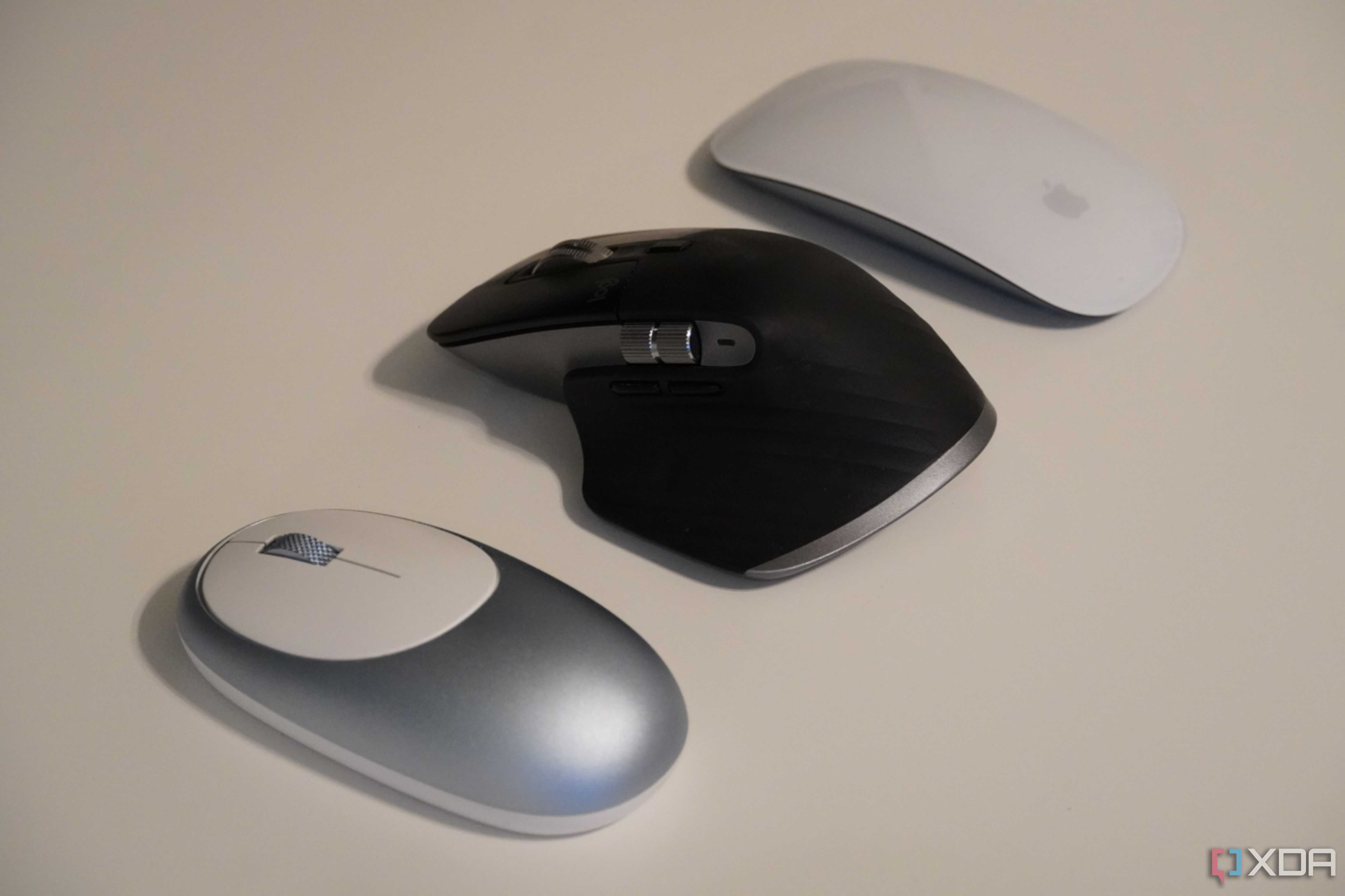 Comparing three mice on a desk.