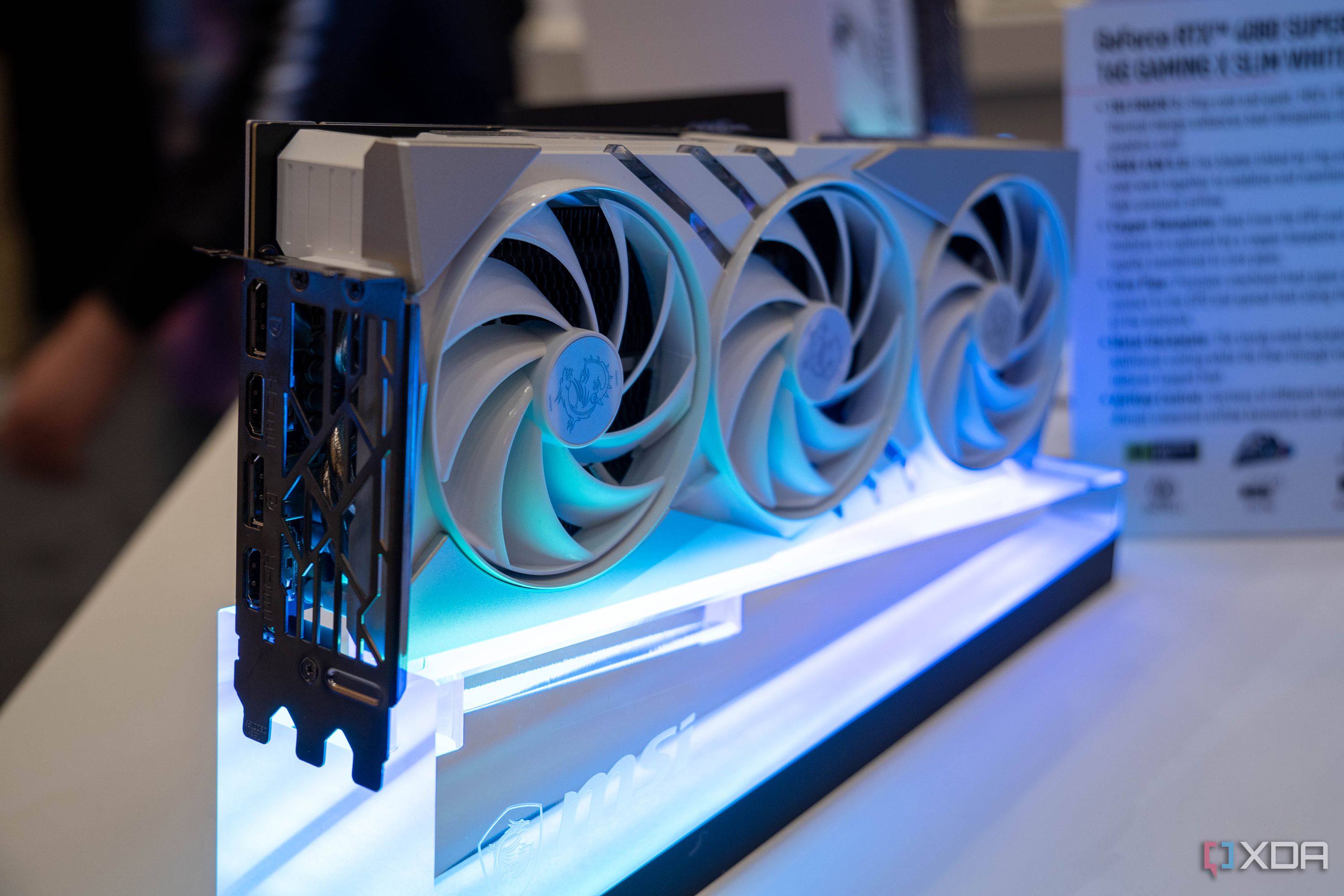 An image of a white MSI GPU on an LED display mount.