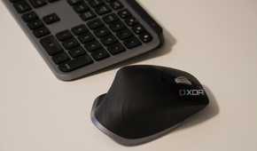 A side view of the MX Master 3 on a desk, with an MX Master Keyboard.