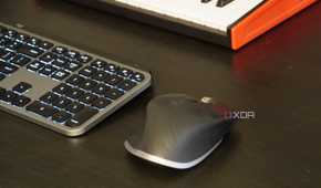 An MX Master 3 mouse on a desk setup.