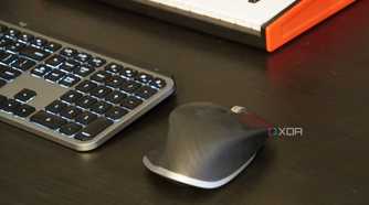An MX Master 3 mouse on a desk setup.