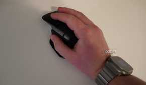A hand resting on the MX Master 3 mouse.