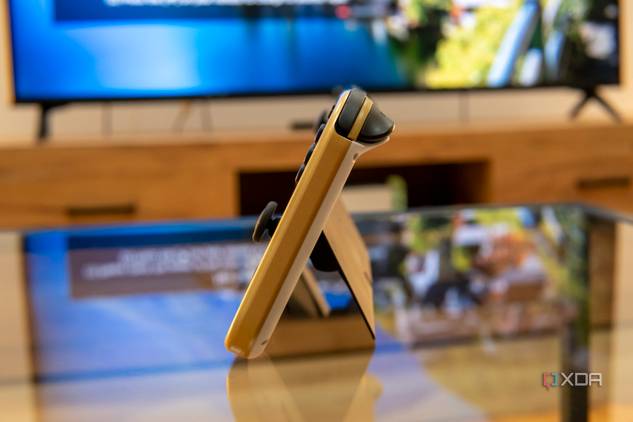 Side view of a Nintendo Switch OLED model standing on its kickstand