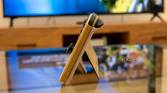 Side view of a Nintendo Switch OLED model standing on its kickstand